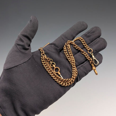 Antique British rolled gold double Albert chain with brass key fob